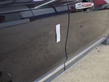 a close up of a car door with a sticker on it