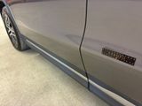 a close up of a car door with a sticker on it