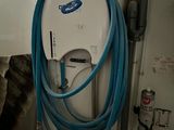 a blue and white hose attached to a wall