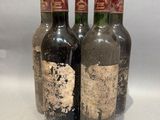 three bottles of wine sitting next to each other on a table