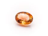 an orange sapphire gems on a white background