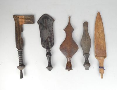 several different types of knives are lined up on a white surface