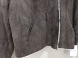 the jacket is made of sued and has a fur lined collar