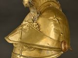 gold helmet of a roman soldier with a helmet on top of it