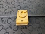 an image of a close up of a purse with a lock on it