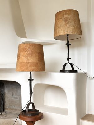 two lamps that are sitting on a table in a room