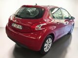 a red car that is parked in a room
