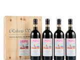 trois bouteilles de vin rouge devant une caisse en bois