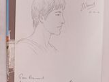 dessin au stylo représentant le profil d'une femme dans un livre
