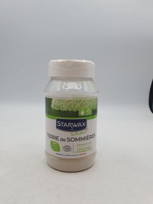une bouteille de cire « Star Wax » posée sur une table