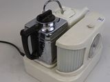 a small white object with a camera attached to it