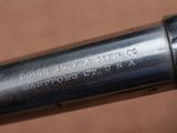 a close up of a metal pipe with a black handle