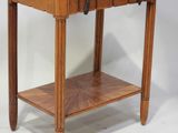 a small wooden table with a drawer on top of it