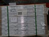 a large stack of packages on a pallet in a warehouse