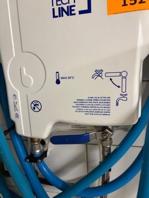 a white tank with blue hoses attached to it