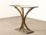 an image of a table with a glass top on a concrete floor