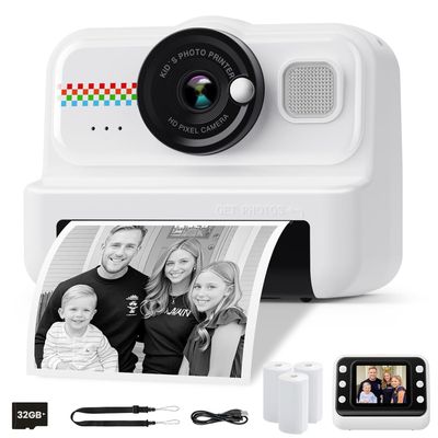 an image of a polaroid camera with a roll of paper next to it