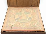 an old wooden box with a painting inside of it