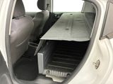 a car that has a tray in the back of it