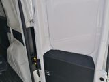 a white van with the door open on the side of the road