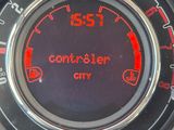 a close up of a speedometer on a car ' s dashboard