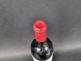 a bottle of wine that is sitting on a table