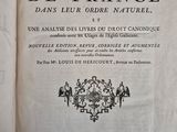 an old book with a black and white image of people on it