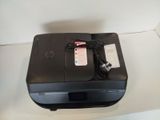 a black printer sitting on top of a white table