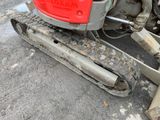 a close up of a small tractor with a track