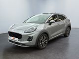 une voiture argentée garée dans une pièce au sol noir
