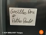 a sign on the door of a small refrigerator