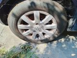 a car that has a tire on the side of the road
