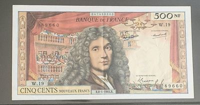 une photo d'un billet de banque sur lequel figure le portrait d'un homme