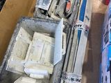 a box of tools sitting on the floor next to a box of tools