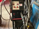 a machine that is sitting on the floor in the garage