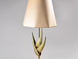 an image of a lamp with a gold shade on it