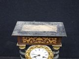 a small table with a clock on top of it