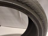 a close up of a tire on a white surface