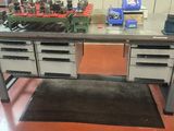 a workbench with a lot of tools on it