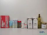 many different types of skin care products lined up on a shelf