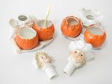 a group of ceramic figurines that are sitting on a table