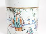 a white cup with a picture of a man and a dog on it