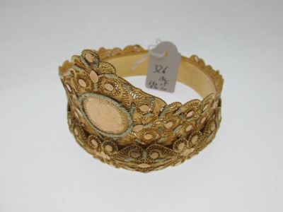 an image of a close up of a bracelet on a white surface