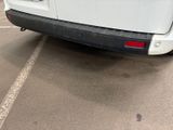 a white van that is parked in a parking lot