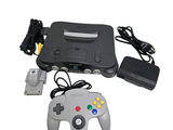 a video game console with a controller and a charger