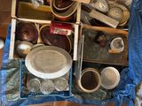 a lot of pots and pans that are sitting on the floor