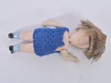 a doll that is laying down on the floor