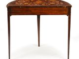an old wooden table with a small drawer on top of it