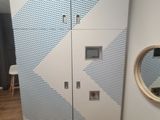 a white cabinet with a mirror on it in a room