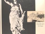 a black and white photo of a statue of a woman in a dress